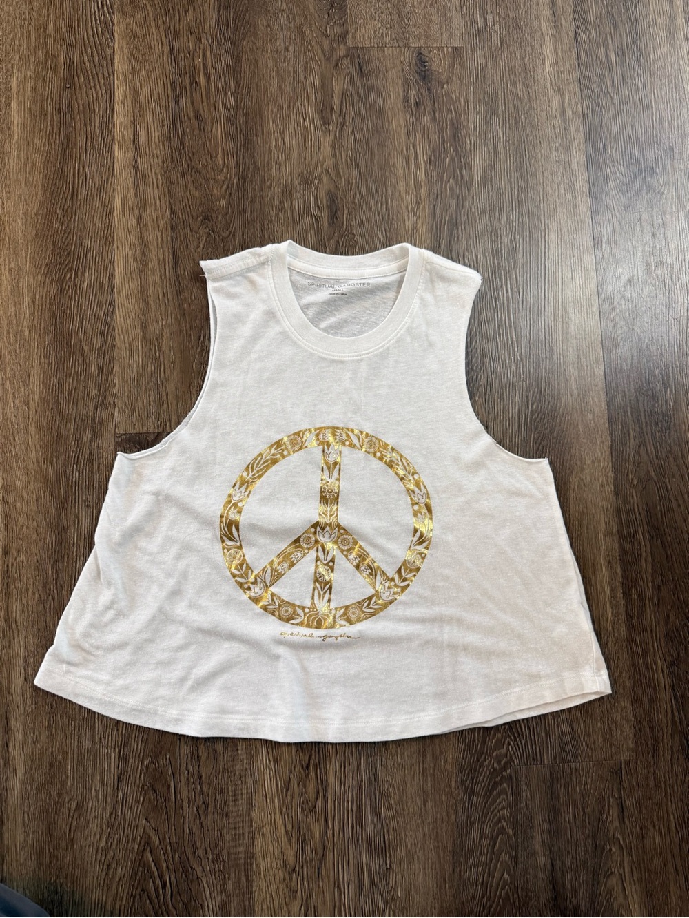 Revolve Spiritual Gangster Peace Crop Tank with a gold foil graphic